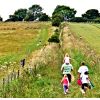 Family going to picnic on Oliver's castle, signs to the left lead to the castle after exiting the carpark to the west.